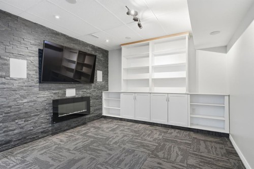 99 Sage Valley Park Nw, Calgary, AB - Indoor Photo Showing Other Room With Fireplace