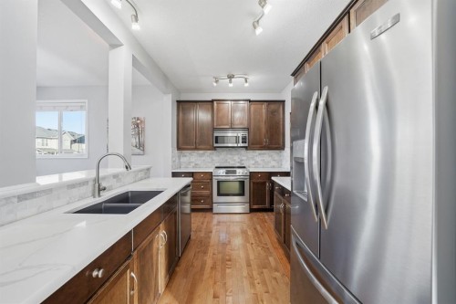 99 Sage Valley Park Nw, Calgary, AB - Indoor Photo Showing Kitchen With Double Sink With Upgraded Kitchen