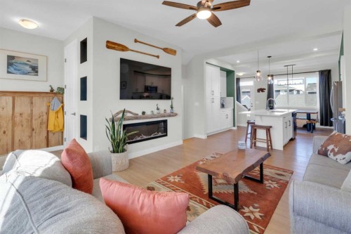 374 Sundown Road, Cochrane, AB - Indoor Photo Showing Living Room With Fireplace