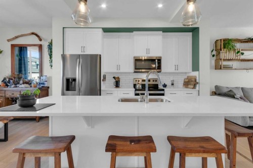 374 Sundown Road, Cochrane, AB - Indoor Photo Showing Kitchen With Double Sink With Upgraded Kitchen