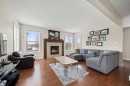 49 Evansview Manor Nw, Calgary, AB  - Indoor Photo Showing Living Room With Fireplace 