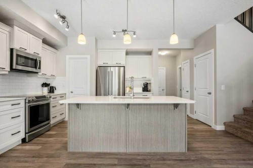 183 Kinniburgh Road, Chestermere, AB - Indoor Photo Showing Kitchen With Stainless Steel Kitchen With Upgraded Kitchen