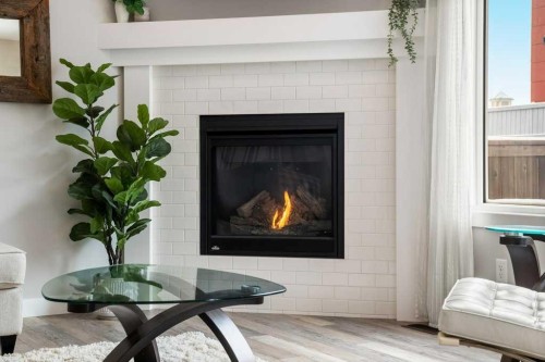 183 Kinniburgh Road, Chestermere, AB - Indoor Photo Showing Living Room With Fireplace