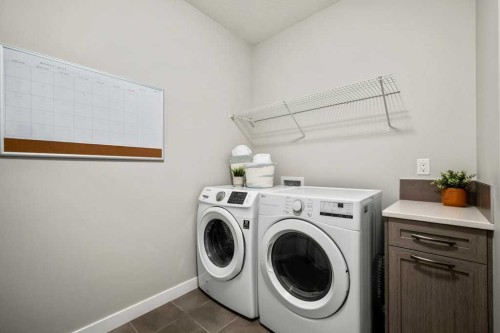 183 Kinniburgh Road, Chestermere, AB - Indoor Photo Showing Laundry Room