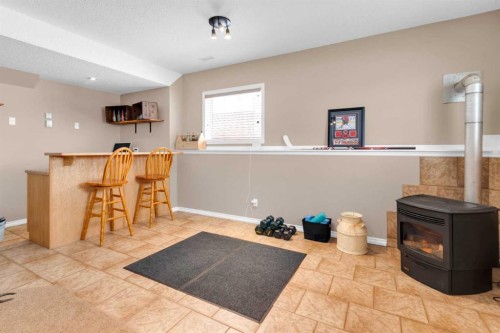 924 Heritage Estates Drive, Acme, AB - Indoor Photo Showing Other Room With Fireplace