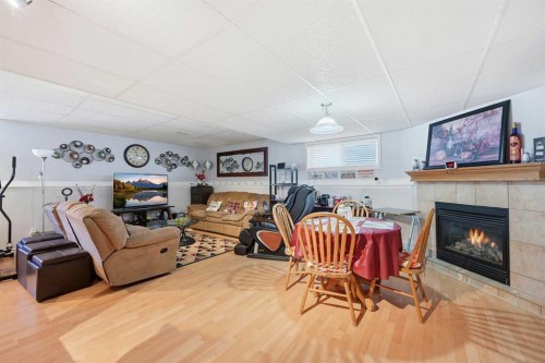 311 Saddlecreek Point Ne, Calgary, AB - Indoor Photo Showing Living Room With Fireplace