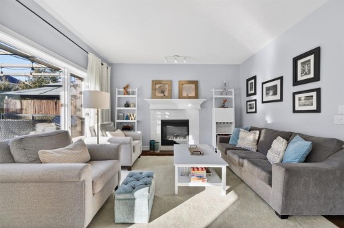 29 Cougarstone Manor Sw, Calgary, AB - Indoor Photo Showing Living Room With Fireplace