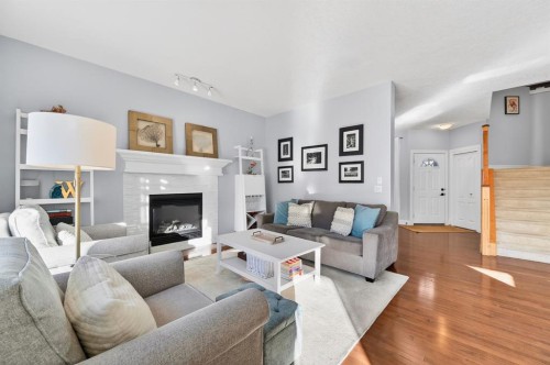 29 Cougarstone Manor Sw, Calgary, AB - Indoor Photo Showing Living Room With Fireplace
