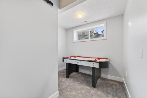 29 Cougarstone Manor Sw, Calgary, AB - Indoor Photo Showing Other Room