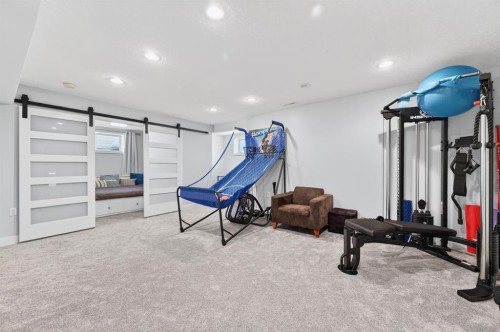 29 Cougarstone Manor Sw, Calgary, AB - Indoor Photo Showing Gym Room