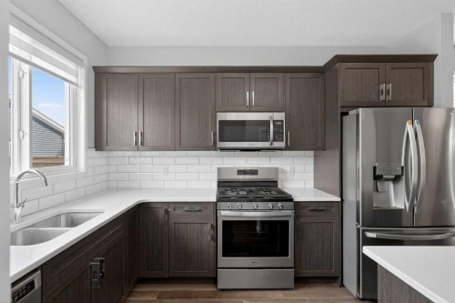 953 West Lakeview Drive, Chestermere, AB - Indoor Photo Showing Kitchen With Double Sink
