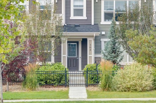 165 Sundown Road, Cochrane, AB - Outdoor With Facade