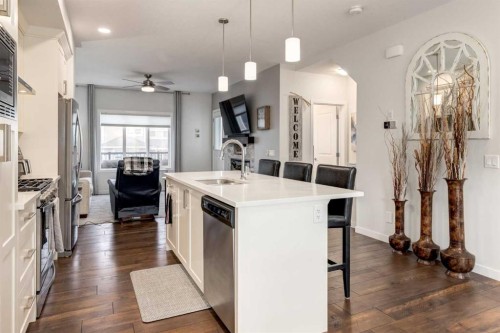 165 Sundown Road, Cochrane, AB - Indoor Photo Showing Kitchen With Upgraded Kitchen