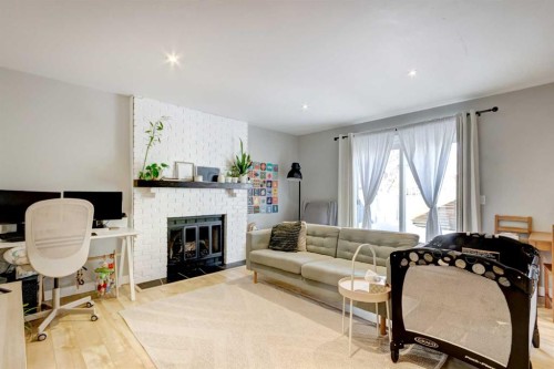 156 Cedarbrook Way Sw, Calgary, AB - Indoor Photo Showing Living Room With Fireplace