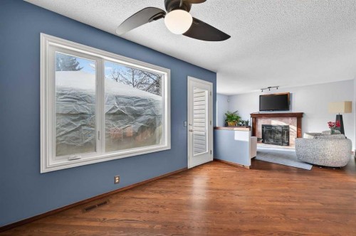 52 Riverwood Circle Se, Calgary, AB - Indoor With Fireplace