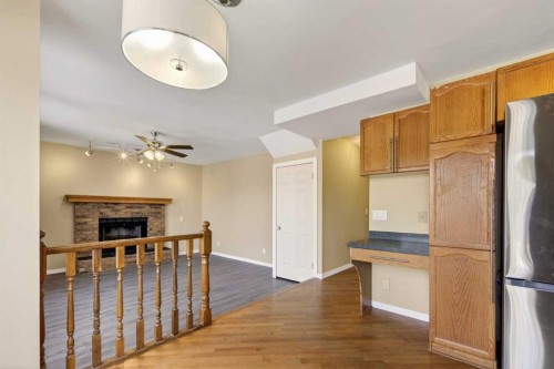 84 Rivergreen Crescent Se, Calgary, AB - Indoor With Fireplace