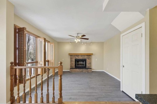 84 Rivergreen Crescent Se, Calgary, AB - Indoor With Fireplace