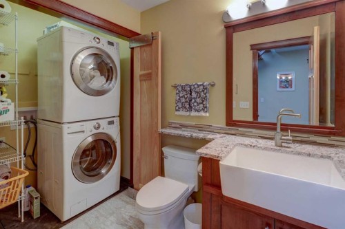 66 Scimitar Point Nw, Calgary, AB - Indoor Photo Showing Laundry Room