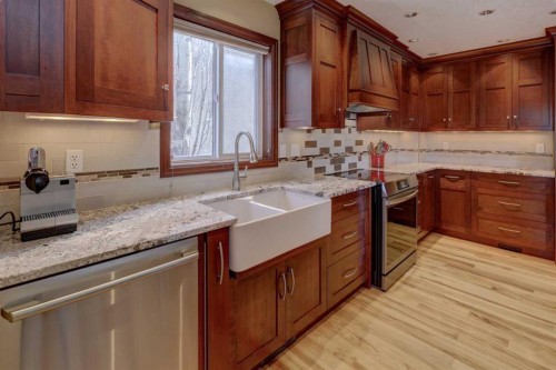 66 Scimitar Point Nw, Calgary, AB - Indoor Photo Showing Kitchen With Double Sink