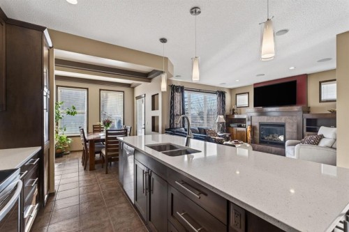 3 Pantego Avenue Nw, Calgary, AB - Indoor Photo Showing Kitchen With Fireplace With Double Sink With Upgraded Kitchen