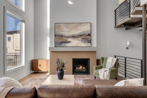 2044 Waterbury Road, Chestermere, AB - Indoor Photo Showing Living Room With Fireplace