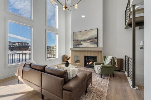 2044 Waterbury Road, Chestermere, AB - Indoor Photo Showing Living Room With Fireplace