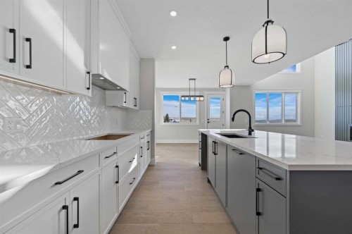 68 Heritage Ridge, Cochrane, AB - Indoor Photo Showing Kitchen With Upgraded Kitchen