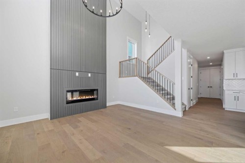68 Heritage Ridge, Cochrane, AB - Indoor With Fireplace
