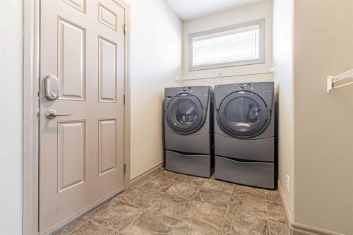 67 Evergreen Row Sw, Calgary, AB - Indoor Photo Showing Laundry Room