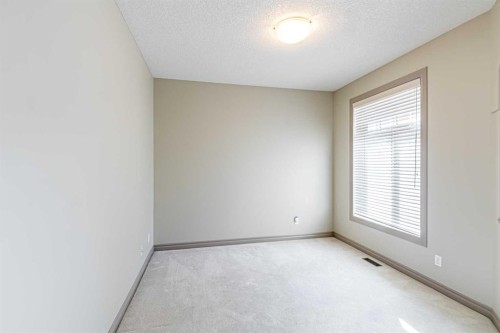 67 Evergreen Row Sw, Calgary, AB - Indoor Photo Showing Other Room