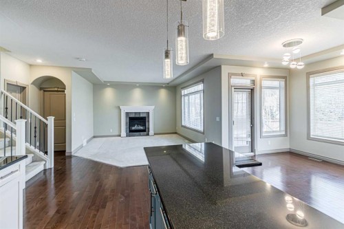 67 Evergreen Row Sw, Calgary, AB - Indoor With Fireplace