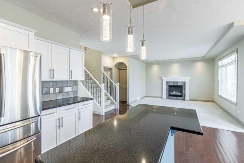 67 Evergreen Row Sw, Calgary, AB - Indoor With Fireplace