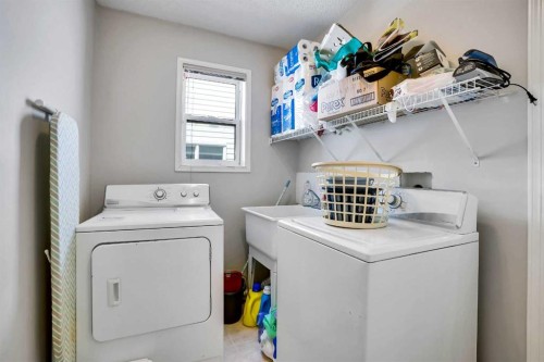 69 Coral Springs Park Ne, Calgary, AB - Indoor Photo Showing Laundry Room