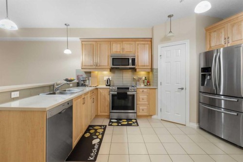 8103-14 Hemlock Crescent Sw, Calgary, AB - Indoor Photo Showing Kitchen With Stainless Steel Kitchen With Double Sink