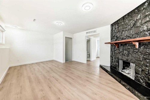 532 Rundleridge Drive Ne, Calgary, AB - Indoor Photo Showing Other Room With Fireplace
