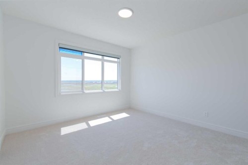 209-414 Seton Passage Se, Calgary, AB - Indoor Photo Showing Other Room