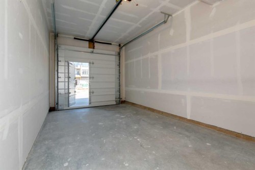 209-414 Seton Passage Se, Calgary, AB - Indoor Photo Showing Garage