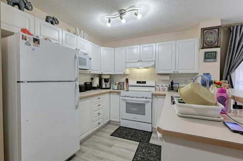 501 Coral Cove Ne, Calgary, AB - Indoor Photo Showing Kitchen