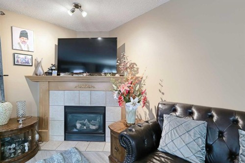 501 Coral Cove Ne, Calgary, AB - Indoor With Fireplace