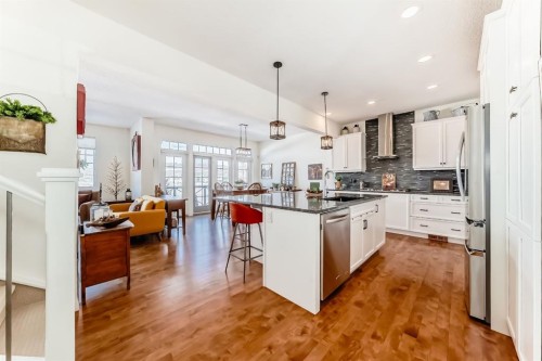 44 Riviera Way, Cochrane, AB - Indoor Photo Showing Kitchen With Stainless Steel Kitchen With Upgraded Kitchen