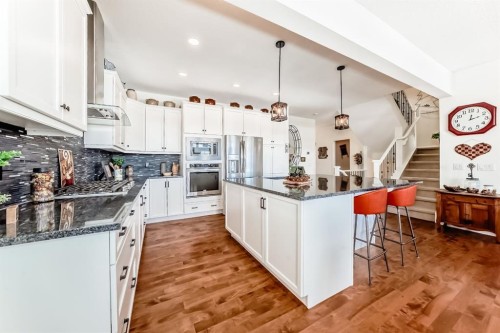 44 Riviera Way, Cochrane, AB - Indoor Photo Showing Kitchen With Stainless Steel Kitchen With Upgraded Kitchen