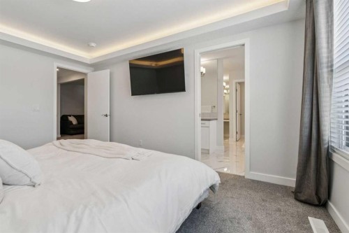 55 Sundown Crescent, Cochrane, AB - Indoor Photo Showing Bedroom