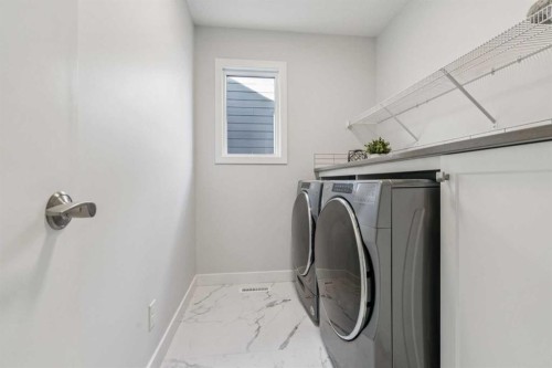 55 Sundown Crescent, Cochrane, AB - Indoor Photo Showing Laundry Room