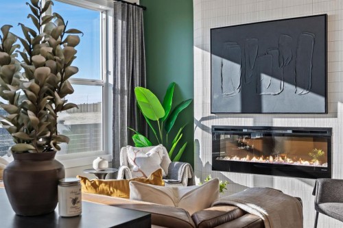 61 Keystone Creek Terrace, Calgary, AB - Indoor Photo Showing Living Room With Fireplace