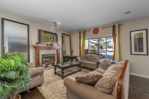 32 Evanspark Circle Nw, Calgary, AB - Indoor Photo Showing Living Room With Fireplace