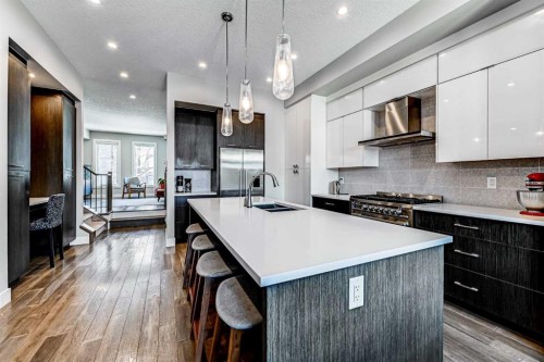 100 Burma Star Road Sw, Calgary, AB - Indoor Photo Showing Kitchen With Double Sink With Upgraded Kitchen