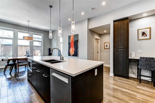 100 Burma Star Road Sw, Calgary, AB - Indoor Photo Showing Kitchen With Double Sink With Upgraded Kitchen