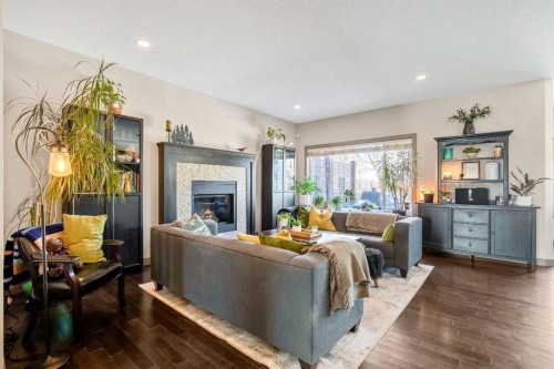 77 Elgin Meadows Manor Se, Calgary, AB - Indoor Photo Showing Living Room With Fireplace