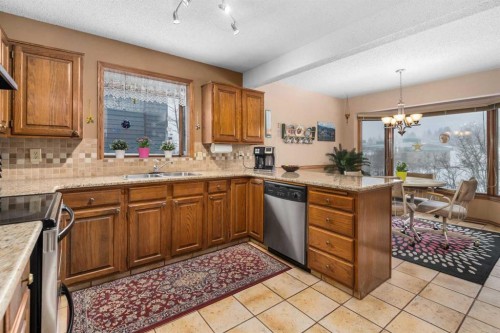 124 Strathbury Circle Sw, Calgary, AB - Indoor Photo Showing Kitchen With Double Sink