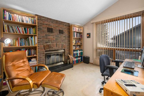 124 Strathbury Circle Sw, Calgary, AB - Indoor Photo Showing Office With Fireplace